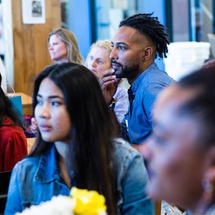 U N E students sitting during the Scholars of Color Breakfast